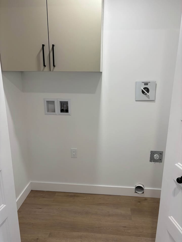Entrée laveuse-secheuse dans un appartement de l'immeuble L'Horizon.